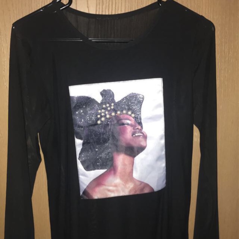 Black long sleeve blouse. See through.
